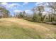 Expansive grassy backyard perfect for outdoor activities and relaxation under a bright, sunny sky at 422 Lee Ave, Wadesboro, NC 28170