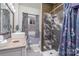 Updated bathroom with a glass-enclosed shower, stylish vanity, and modern finishes perfect for a relaxing spa day at 422 Lee Ave, Wadesboro, NC 28170