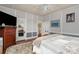 Cozy bedroom features hardwood floors, a comfortable bed, and plenty of natural light from the windows at 422 Lee Ave, Wadesboro, NC 28170