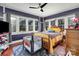 Inviting bedroom featuring hardwood floors, a ceiling fan, and large windows offering lots of natural light at 422 Lee Ave, Wadesboro, NC 28170