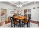 Cozy dining room with coffered ceiling, wood floors, and square wood table perfect for entertaining guests at 422 Lee Ave, Wadesboro, NC 28170