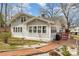 Beautiful home featuring fresh siding, a well-manicured lawn, and gorgeous landscaping surrounding the residence at 422 Lee Ave, Wadesboro, NC 28170