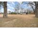 Expansive lot surrounded by mature trees, providing privacy and a peaceful setting for this lovely home at 422 Lee Ave, Wadesboro, NC 28170