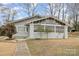Charming craftsman-style home showcasing its inviting front porch, mature landscaping, and well-maintained exterior at 422 Lee Ave, Wadesboro, NC 28170