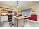 Charming kitchen features stainless steel appliances, a butcher block island, and a farmhouse sink at 422 Lee Ave, Wadesboro, NC 28170