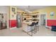 Bright kitchen featuring stainless steel appliances, open shelving, and a butcher block island with bar seating at 422 Lee Ave, Wadesboro, NC 28170