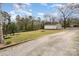 Large lot with a garage and fire pit, perfect for outdoor entertaining and gatherings at 422 Lee Ave, Wadesboro, NC 28170