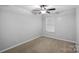 Cozy bedroom with neutral carpet, ceiling fan, and natural light at 4264 Glenlea Commons E Dr, Charlotte, NC 28216