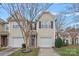 Inviting two-story home featuring a one-car garage and well-maintained landscaping for a charming curb appeal at 4264 Glenlea Commons E Dr, Charlotte, NC 28216