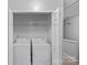 Convenient laundry closet with a washer and dryer on the second floor at 4264 Glenlea Commons E Dr, Charlotte, NC 28216