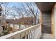 Balcony overlooking a quiet street with condos and mature landscaping at 434 W 8Th St, Charlotte, NC 28202