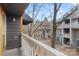 Balcony overlooking a quiet complex with mature trees and landscaping at 434 W 8Th St, Charlotte, NC 28202