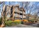 Condominium complex with gray siding, orange accents and multiple balconies at 434 W 8Th St, Charlotte, NC 28202