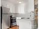 Well-lit kitchen featuring stainless steel appliances, white cabinets, and a subway tile backsplash at 434 W 8Th St, Charlotte, NC 28202