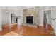 Open concept living room with hardwood floors, stone fireplace and updated kitchen at 434 W 8Th St, Charlotte, NC 28202