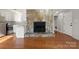 Open concept living room with hardwood floors, stone fireplace and updated kitchen at 434 W 8Th St, Charlotte, NC 28202