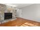 Living room featuring a stone fireplace, hardwood floors and a neutral color scheme at 434 W 8Th St, Charlotte, NC 28202
