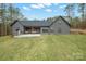 Backyard featuring a grassy area, covered patio with seating, and outdoor grill at 4890 Rio De Luna None, Hickory, NC 28601