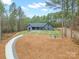 Aerial view of backyard featuring an outdoor seating area, fire pit, and a covered patio at 4890 Rio De Luna None, Hickory, NC 28601