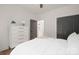 Cozy bedroom featuring white walls, a comfortable bed, and a stylish white dresser with gold accents at 4890 Rio De Luna None, Hickory, NC 28601