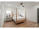 Inviting bedroom showcasing light wood floors, and a cozy four-poster bed with bedside tables at 4890 Rio De Luna None, Hickory, NC 28601