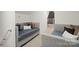 Cozy secondary bedrooms with twin beds, carpeting, soft, neutral decor and comfortable furniture at 4890 Rio De Luna None, Hickory, NC 28601