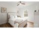 Comfortable bedroom with light wood floors, a large window, and neutral decor for a serene atmosphere at 4890 Rio De Luna None, Hickory, NC 28601