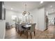 Modern dining room with seating for eight, large windows, and access to the outdoor patio at 4890 Rio De Luna None, Hickory, NC 28601