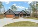 Stunning exterior of a modern home with a large driveway, two-car garage, and beautiful landscaping at 4890 Rio De Luna None, Hickory, NC 28601