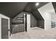 Versatile game room with gray accents, featuring a mini bar, open doorways, and comfortable seating areas at 4890 Rio De Luna None, Hickory, NC 28601