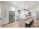 Spacious, modern kitchen with white cabinets, stainless steel appliances, and a large center island at 4890 Rio De Luna None, Hickory, NC 28601