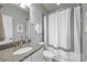 Modern bathroom featuring granite countertops, white cabinets, and a shower-tub combination at 503 Dixter Ln, Charlotte, NC 28211