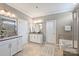 Spacious bathroom with double vanities, tub, and a separate shower at 503 Dixter Ln, Charlotte, NC 28211