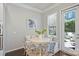 Cozy breakfast nook featuring built-in seating, a round table, natural light, and backyard access at 503 Dixter Ln, Charlotte, NC 28211