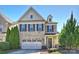 Charming two-story brick home with a well-manicured lawn, attached garage, and inviting front entrance at 503 Dixter Ln, Charlotte, NC 28211