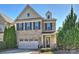 Charming two-story brick home with a well-manicured lawn, attached garage, and inviting front entrance at 503 Dixter Ln, Charlotte, NC 28211
