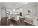 Modern kitchen with white cabinets, granite countertops, stainless steel appliances, and cozy breakfast nook at 503 Dixter Ln, Charlotte, NC 28211