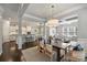 Open-concept living space with a dining area, modern kitchen, and comfortable seating with natural light at 503 Dixter Ln, Charlotte, NC 28211
