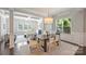 Bright living space with dining area, coffered ceiling, fireplace, large windows, and stylish furnishings at 503 Dixter Ln, Charlotte, NC 28211