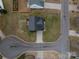 Aerial view of home showcasing the roof, lawn, and location at 5032 Meadow Woods Dr, Lowell, NC 28098
