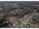 Aerial view of neighborhood showcasing tree-lined streets and house location at 5032 Meadow Woods Dr, Lowell, NC 28098