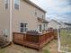 Spacious wooden back deck, perfect for entertaining or relaxing outdoors at 5032 Meadow Woods Dr, Lowell, NC 28098
