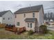 Backyard view of home with a wood deck perfect for entertaining guests at 5032 Meadow Woods Dr, Lowell, NC 28098