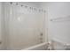 Bathroom tub/shower combo with a white shower curtain at 5032 Meadow Woods Dr, Lowell, NC 28098