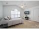 Spacious bedroom with vaulted ceilings, large windows, and a ceiling fan at 5032 Meadow Woods Dr, Lowell, NC 28098