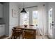 Cozy breakfast nook with natural light, a wooden table, and seating for a casual dining experience at 5032 Meadow Woods Dr, Lowell, NC 28098