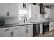 A well-equipped kitchen features white subway tile backsplash and stainless steel appliances for modern convenience at 5032 Meadow Woods Dr, Lowell, NC 28098