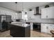A kitchen with a granite countertop island, stainless steel appliances, and stylish pendant lighting at 5032 Meadow Woods Dr, Lowell, NC 28098