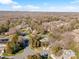 An aerial view showing this house and its surroundings, including mature trees and neighborhood layout at 5101 Gamton Ct, Charlotte, NC 28226