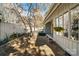 Landscaped backyard with stone walkway, gravel area, and a charming hanging flower basket at 5101 Gamton Ct, Charlotte, NC 28226